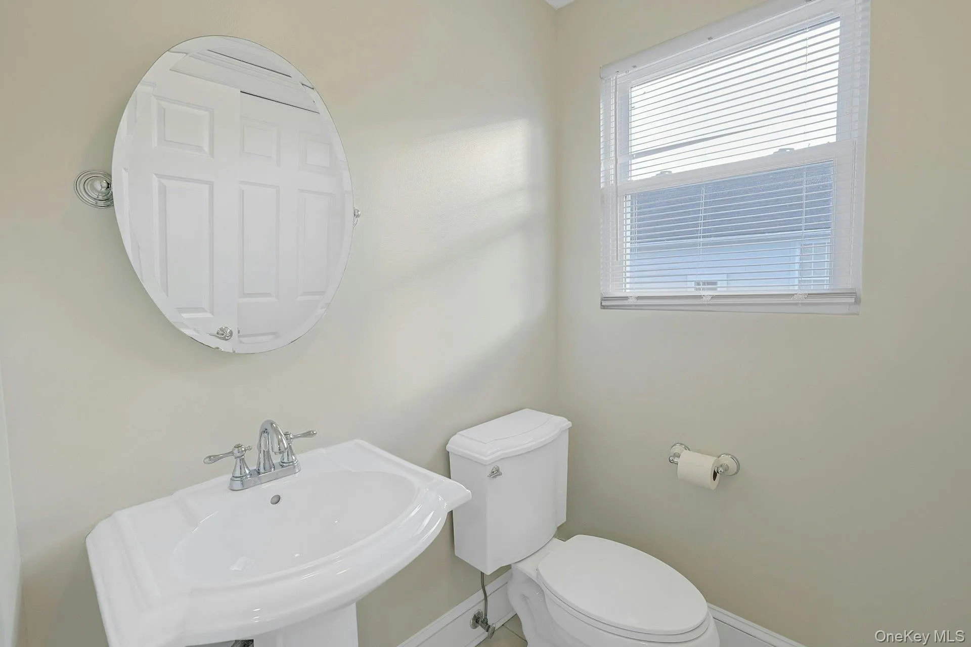 Half bath with toilet and a sink Half bath with toilet and a sink