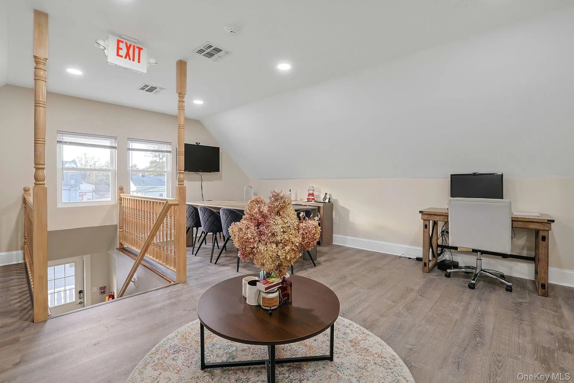 Office featuring vaulted ceiling and recessed lighting Office featuring vaulted ceiling and recessed lighting