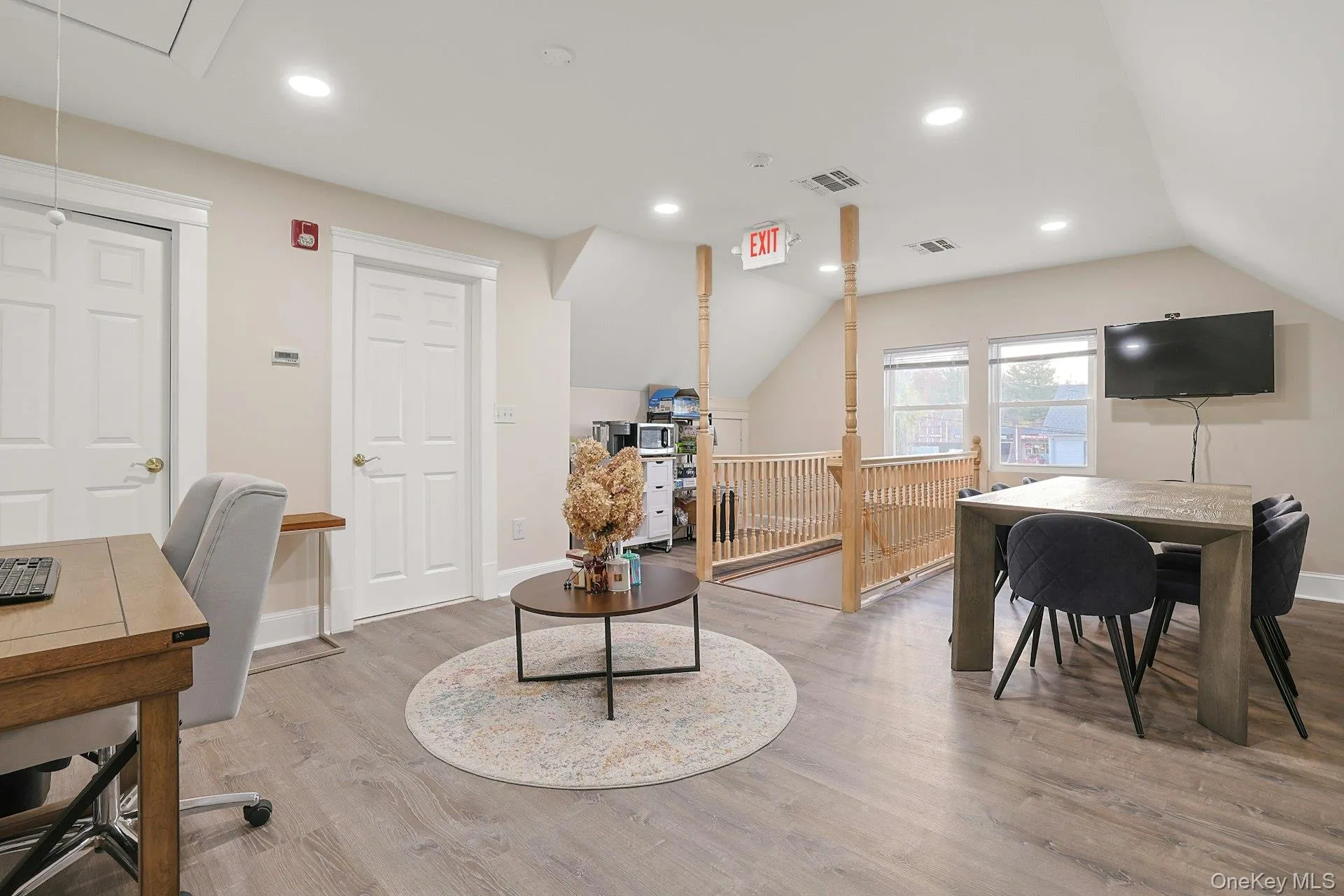 Home office featuring lofted ceiling, attic access, and recessed lighting Home office featuring lofted ceiling, attic access, and recessed lighting
