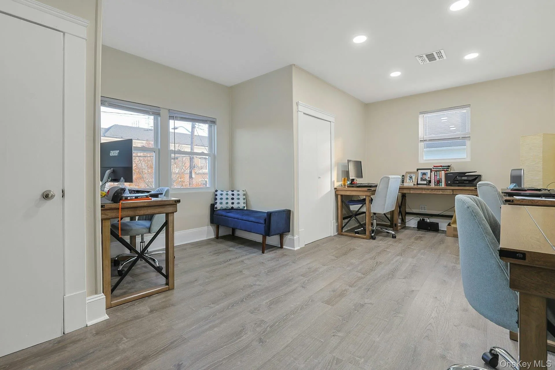 Office with recessed lighting and light wood-style floors Office with recessed lighting and light wood-style floors