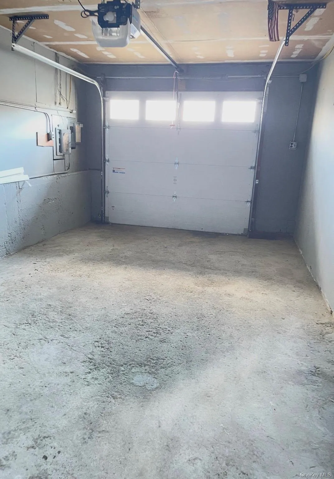 Garage featuring a garage door opener Garage featuring a garage door opener