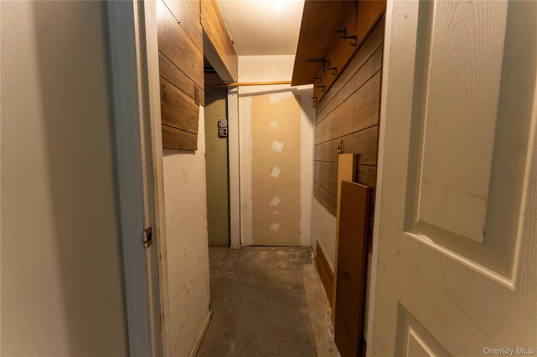 Corridor featuring concrete floors Corridor featuring concrete floors