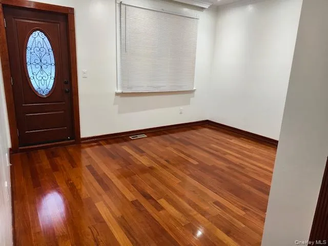 Entryway featuring dark wood finished floors, recessed lighting, and ornamental molding Entryway featuring dark wood finished floors, recessed lighting, and ornamental molding