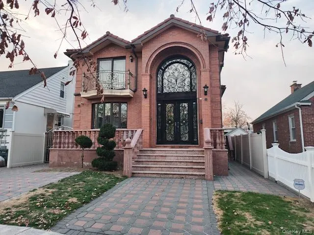 Doorway to property featuring brick siding Doorway to property featuring brick siding