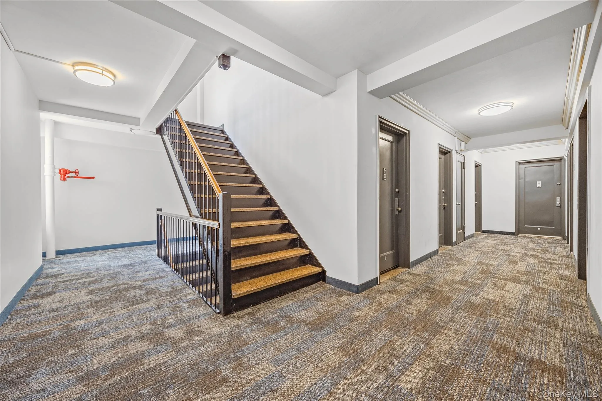 Hall with carpet floors and stairway Hall with carpet floors and stairway