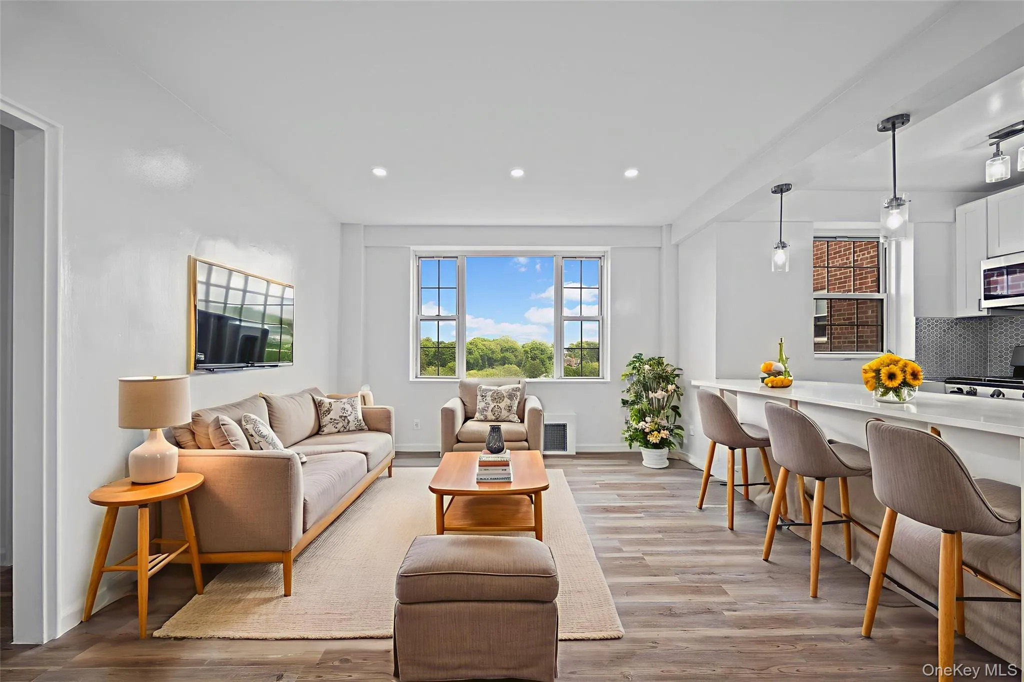Living room featuring recessed lighting and light wood-style floors Living room featuring recessed lighting and light wood-style floors