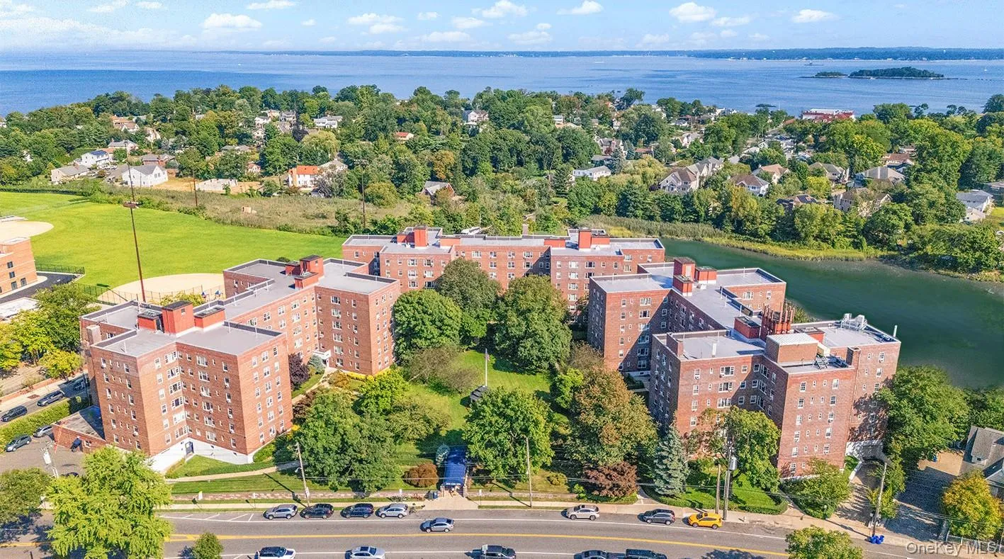 Bird's eye view of apartment complex / building and a large body of water Bird's eye view of apartment complex / building and a large body of water