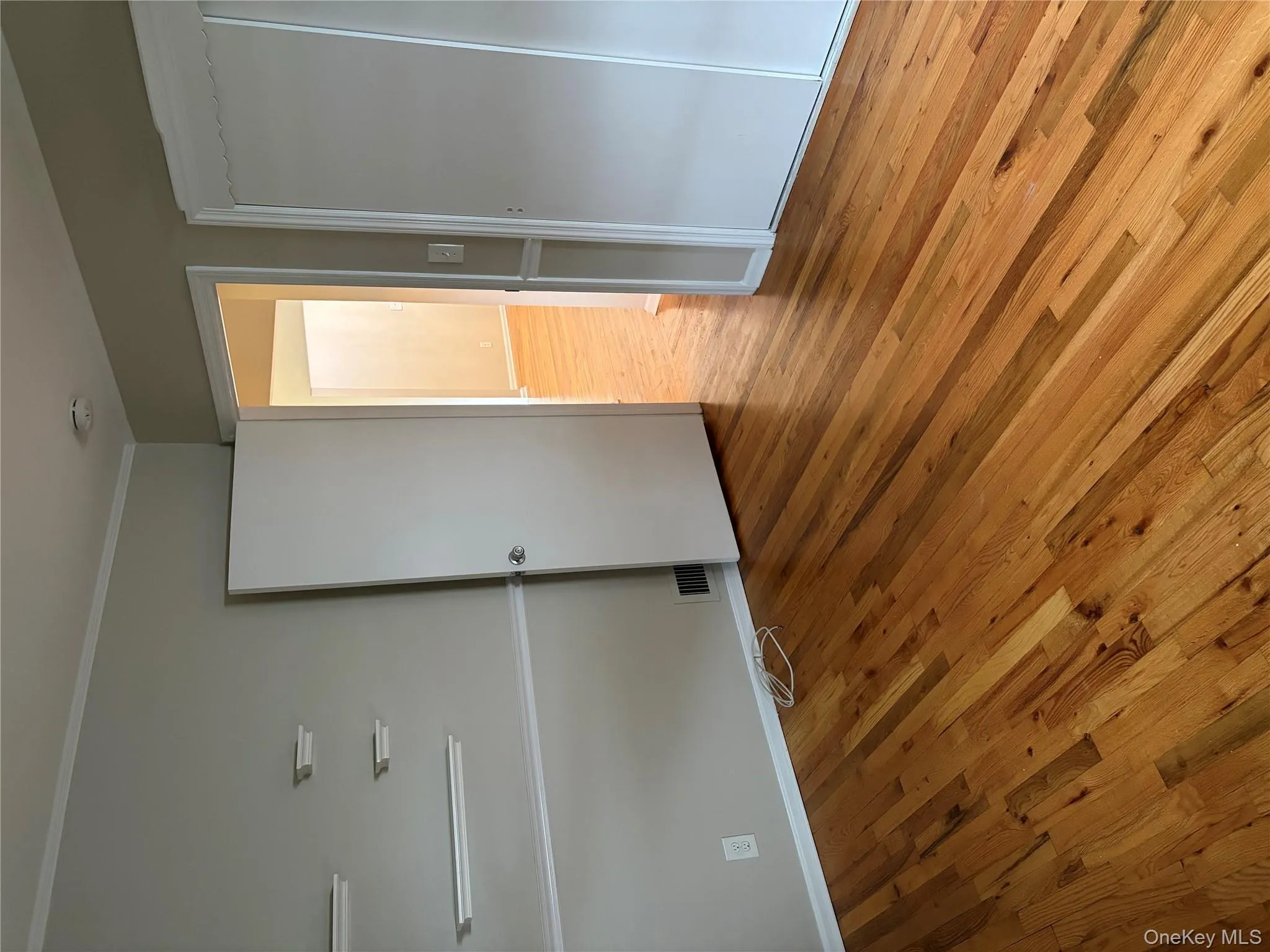 Unfurnished bedroom featuring light wood-style floors and baseboards Unfurnished bedroom featuring light wood-style floors and baseboards