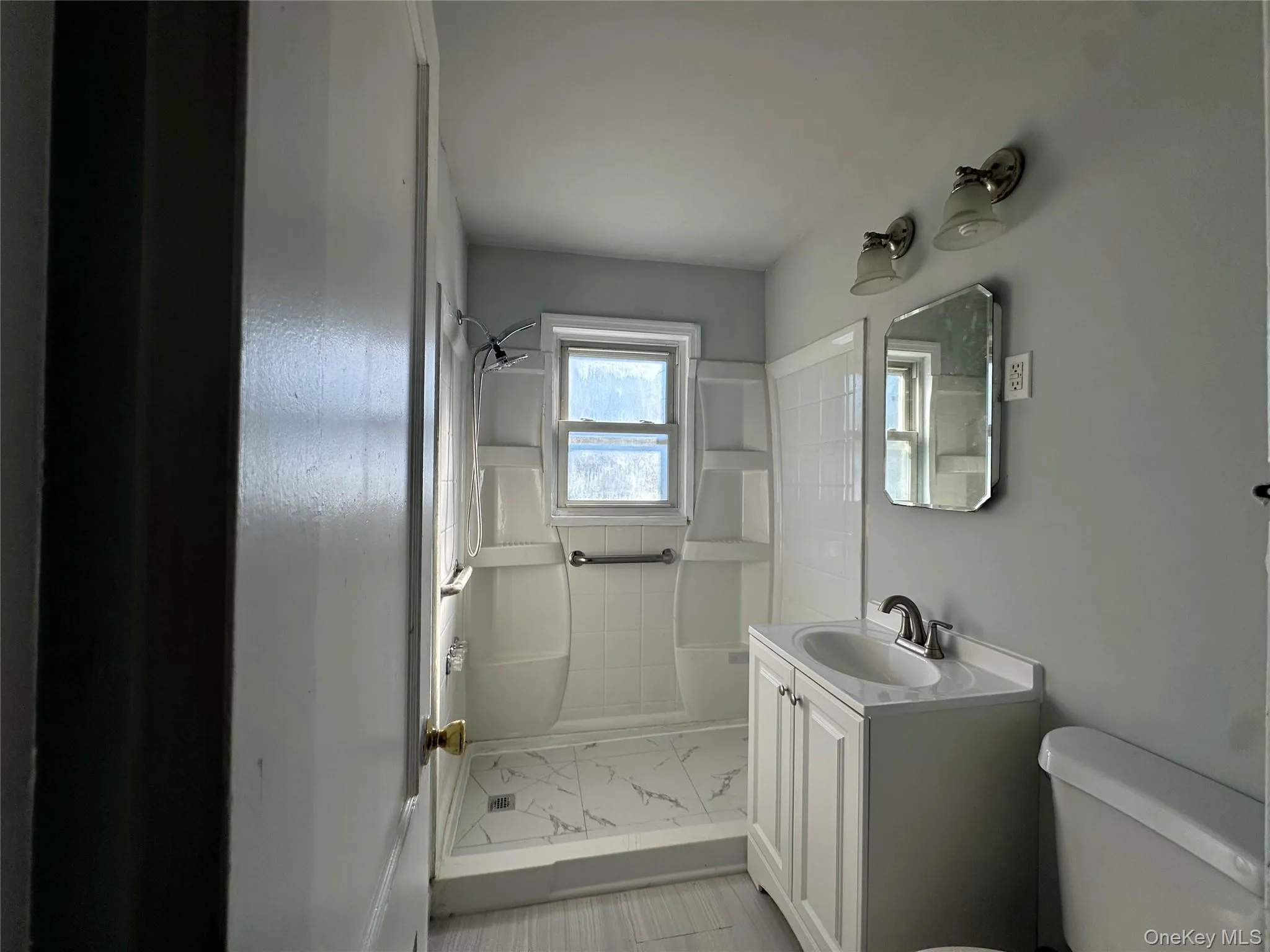 Bathroom with vanity and a shower Bathroom with vanity and a shower