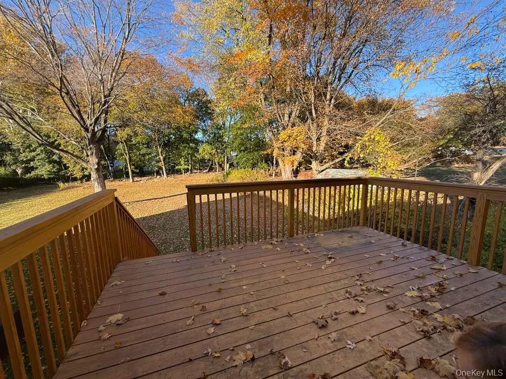 Wooden deck with view of wooded area Wooden deck with view of wooded area