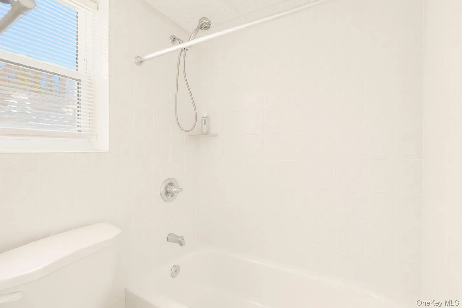 Full bath with bathing tub / shower combination and toilet Full bath with bathing tub / shower combination and toilet