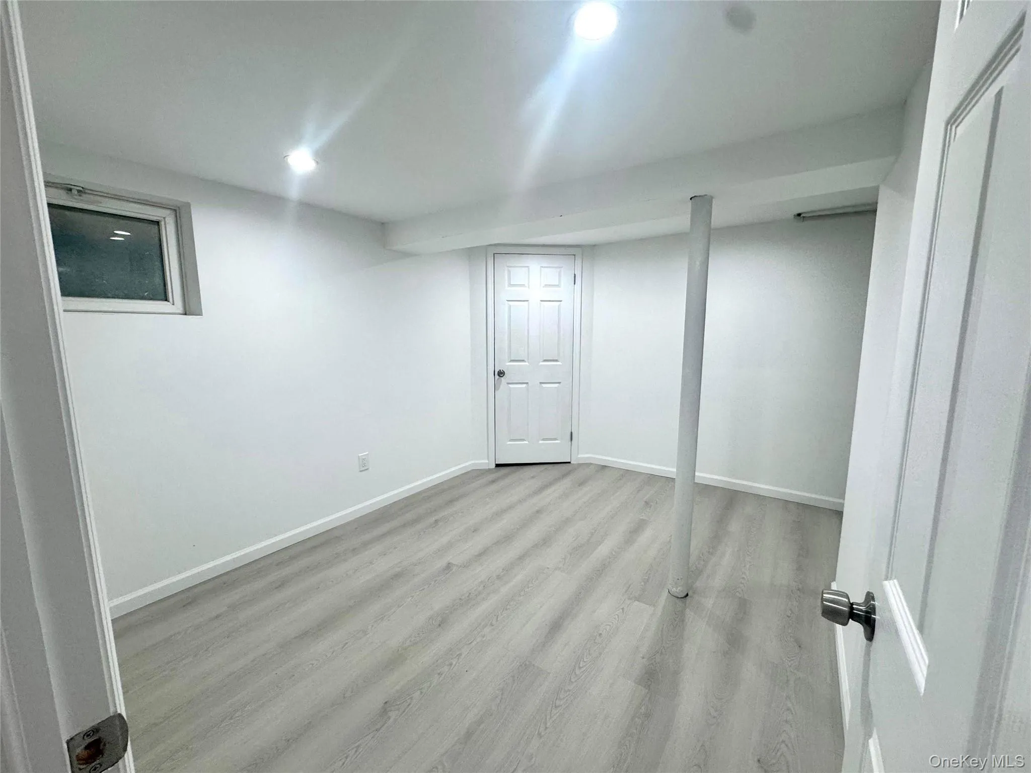 Finished basement featuring light wood-style flooring and recessed lighting Finished basement featuring light wood-style flooring and recessed lighting