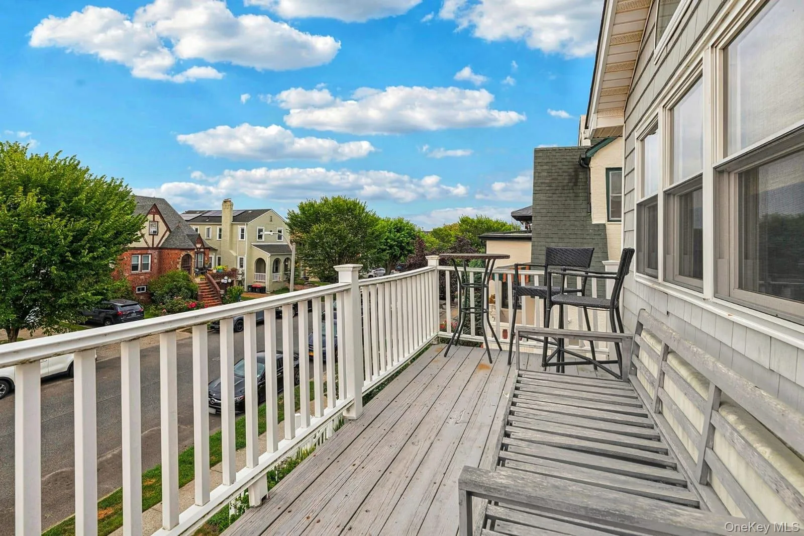 Wooden terrace featuring a residential view Wooden terrace featuring a residential view