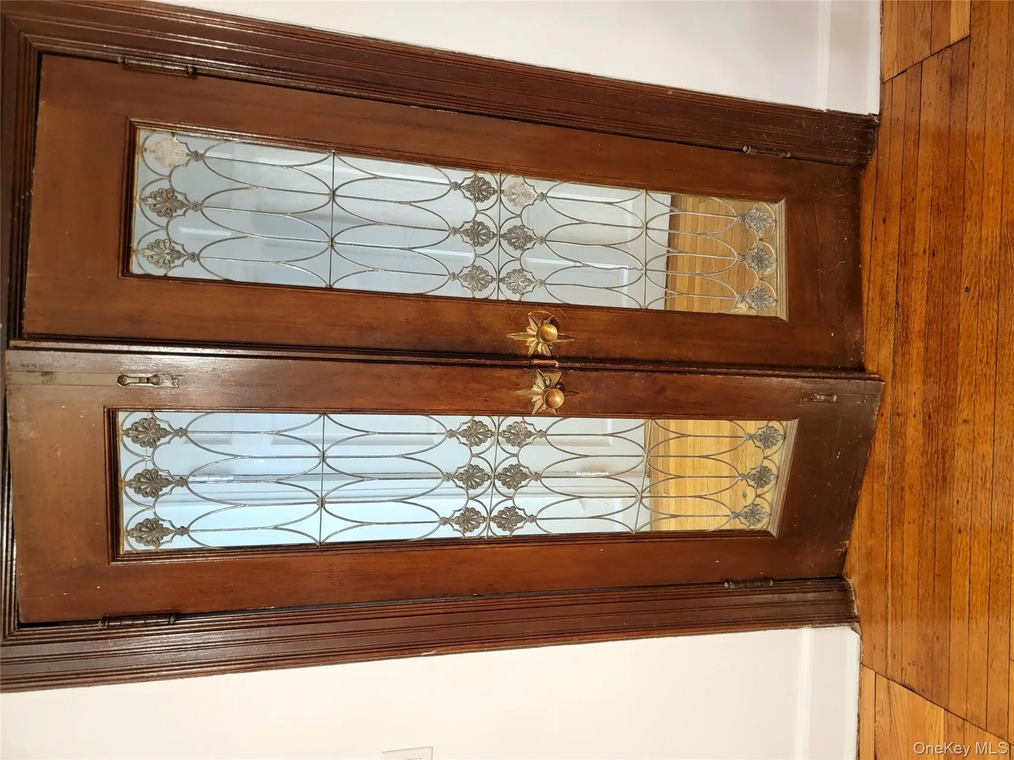 Detailed view of french doors and wood finished floors Detailed view of french doors and wood finished floors