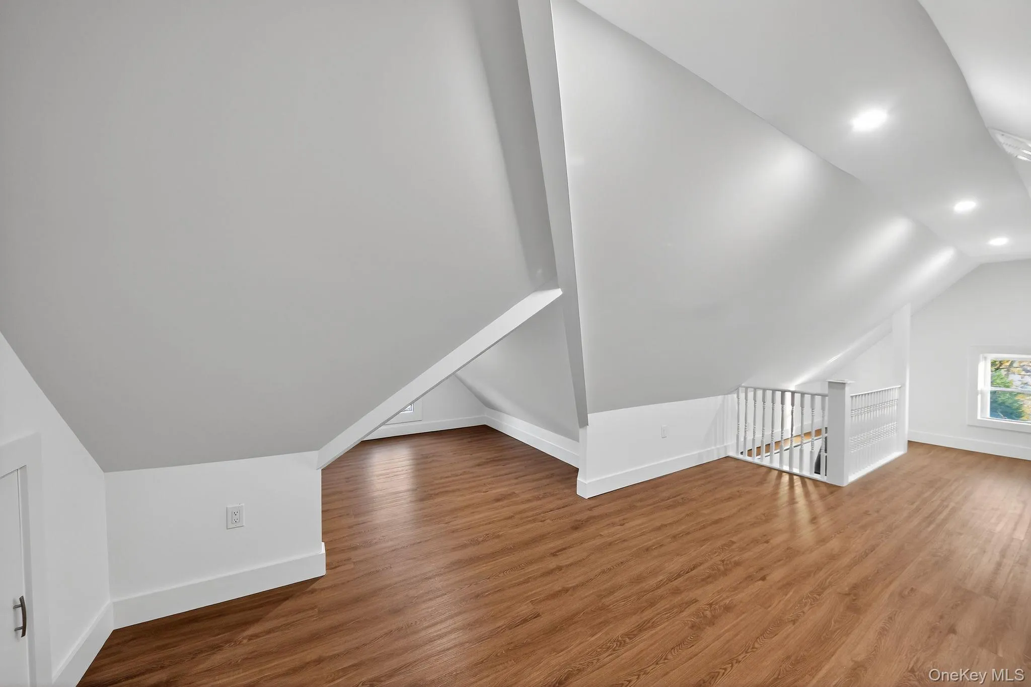 Bonus room featuring lofted ceiling, wood finished floors, and recessed lighting Bonus room featuring lofted ceiling, wood finished floors, and recessed lighting