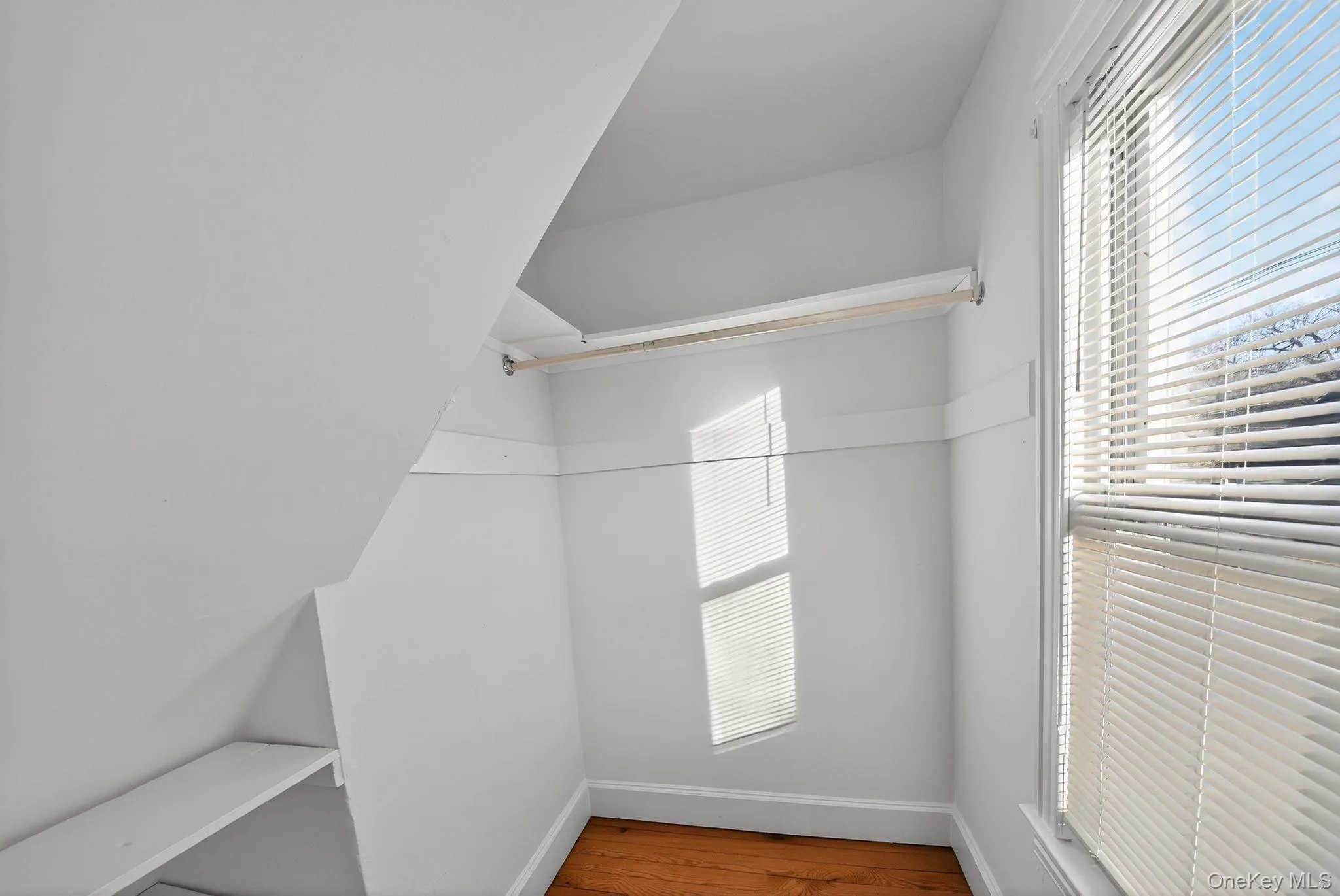 Spacious closet with wood finished floors Spacious closet with wood finished floors