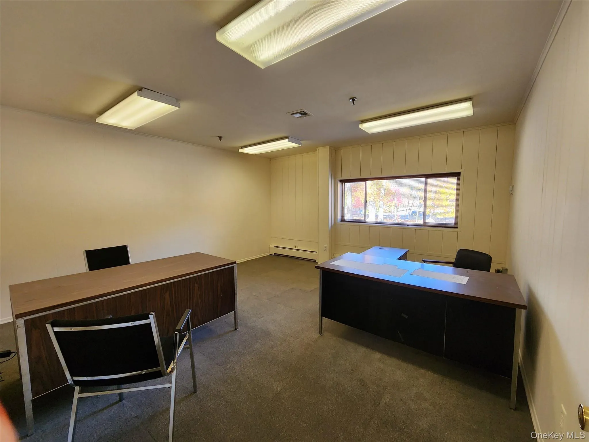 Home office featuring a baseboard heating unit Home office featuring a baseboard heating unit