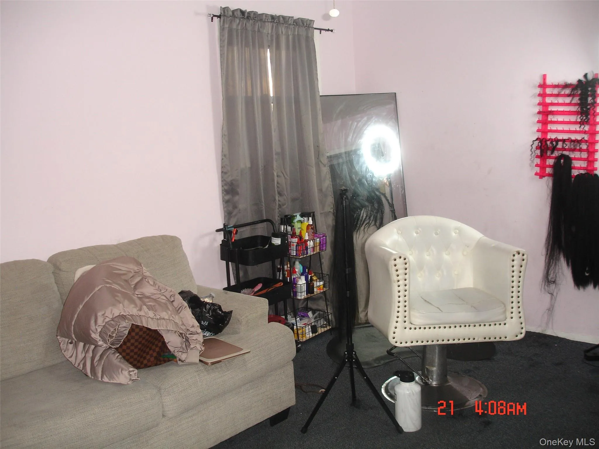 Living area with carpet flooring Living area with carpet flooring