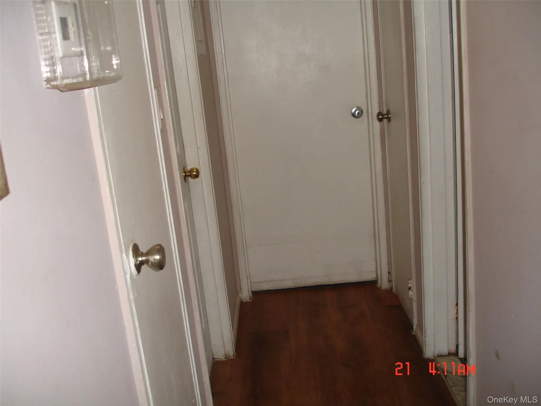 Hallway with dark wood finished floors Hallway with dark wood finished floors
