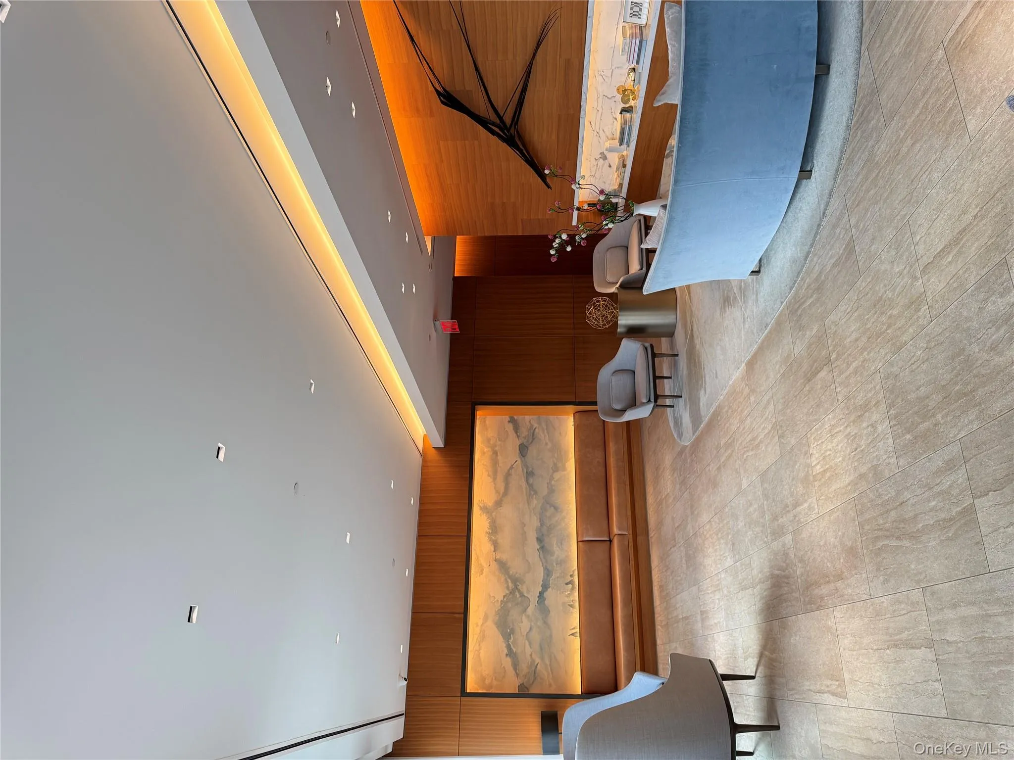 Lobby featuring wooden walls and recessed lighting Lobby featuring wooden walls and recessed lighting