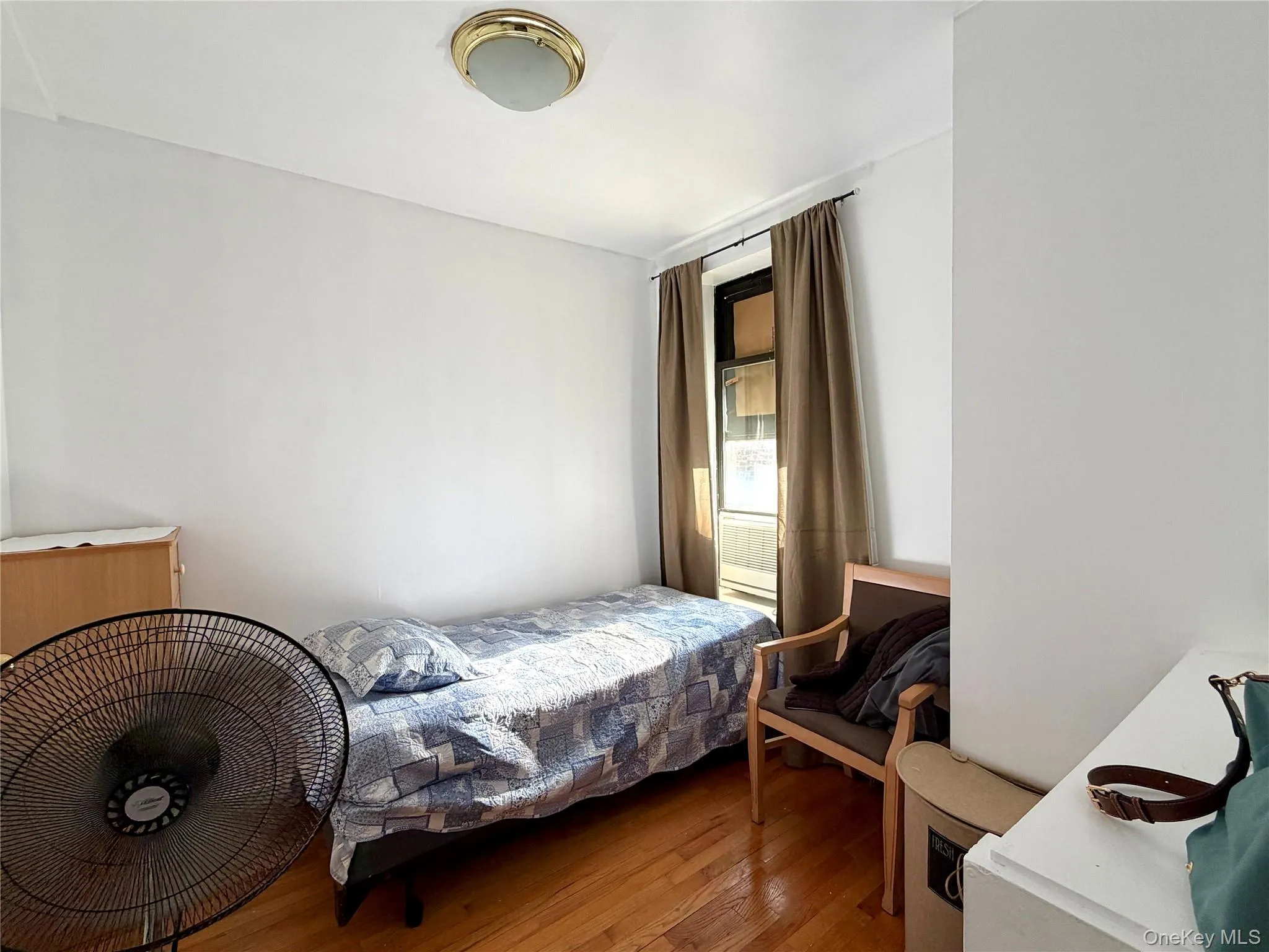 Bedroom with hardwood / wood-style flooring Bedroom with hardwood / wood-style flooring