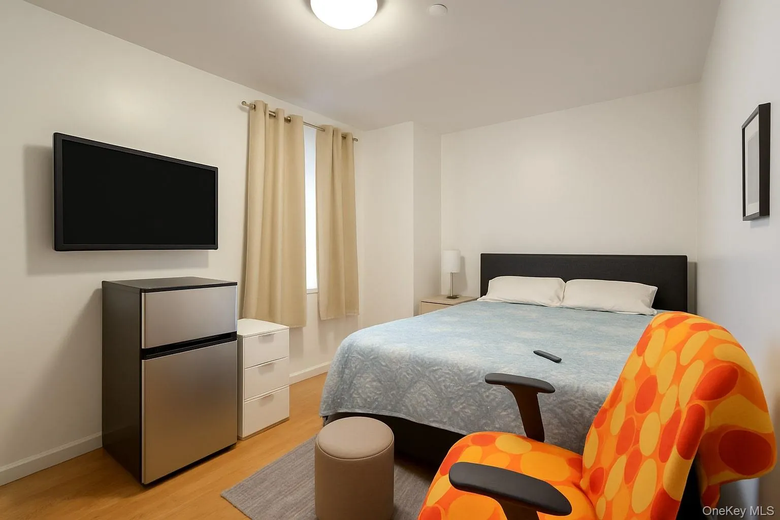Bedroom with light wood-style flooring Bedroom with light wood-style flooring