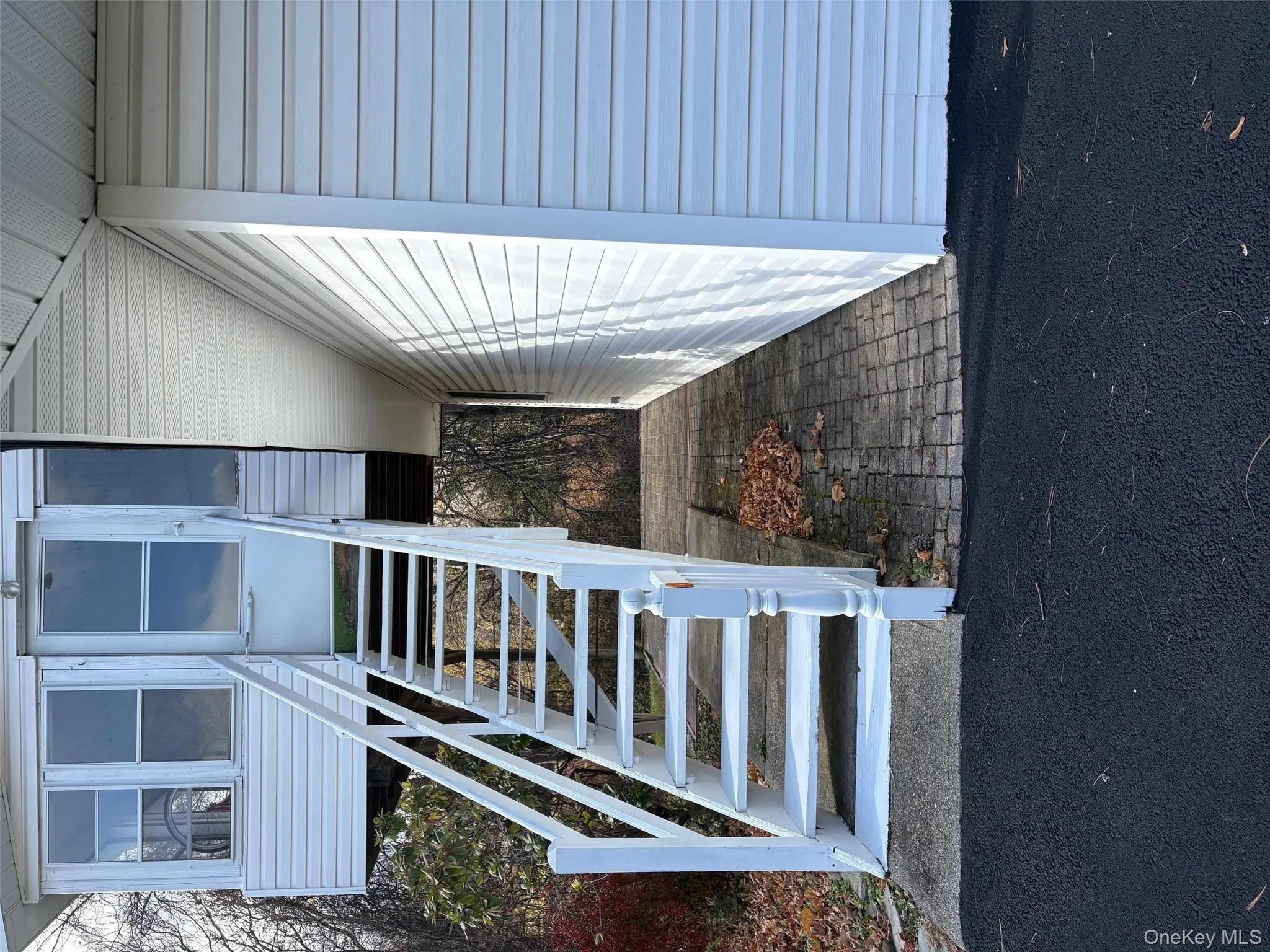 Back Patio on Bottom Floor (Stairs are to the separate upstairs apartment) Back Patio on Bottom Floor (Stairs are to the separate upstairs apartment)