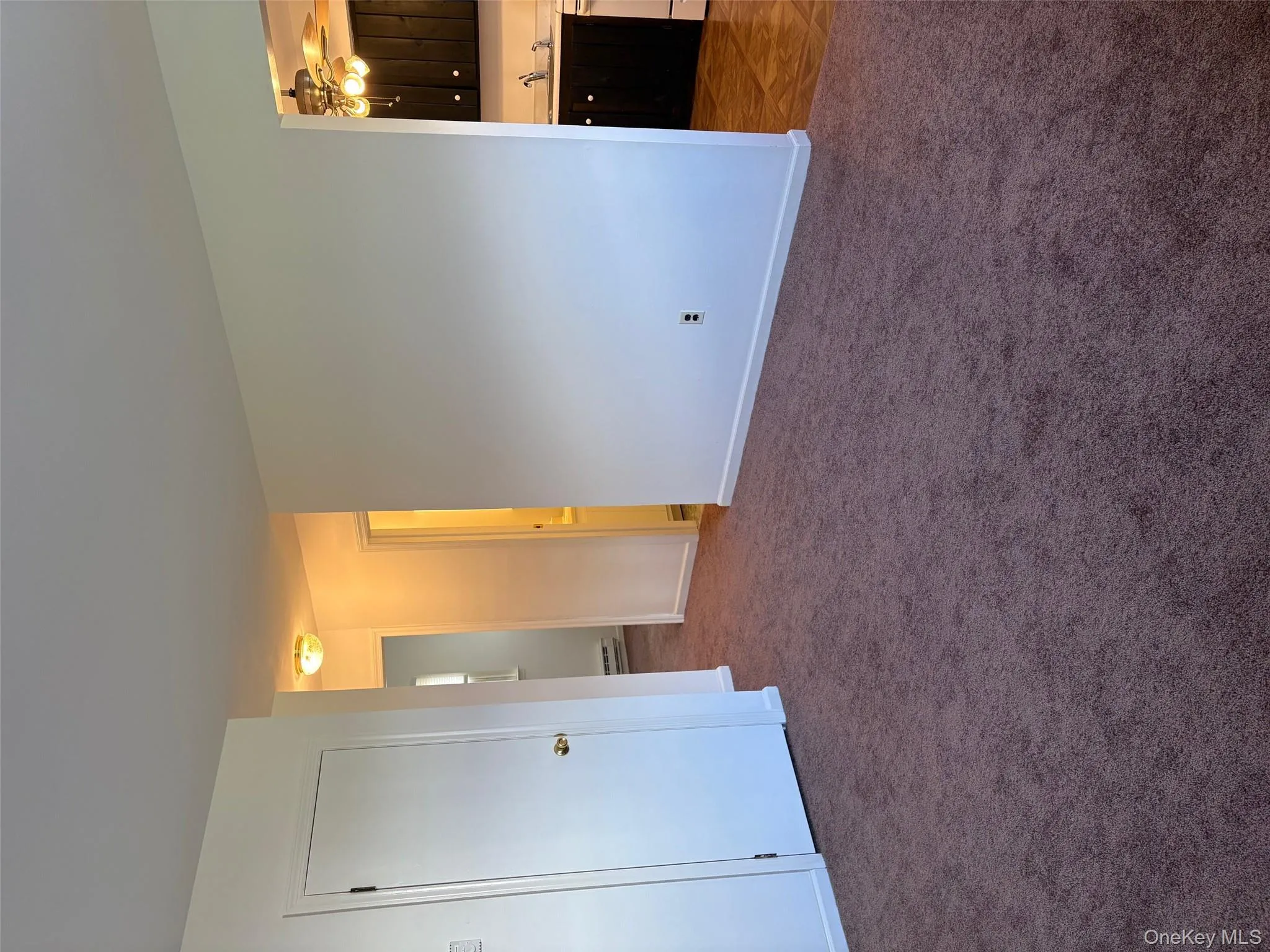 View from Living Room facing Kitchen with Closet and area to bathroom and 2 bedrooms is on the left View from Living Room facing Kitchen with Closet and area to bathroom and 2 bedrooms is on the left