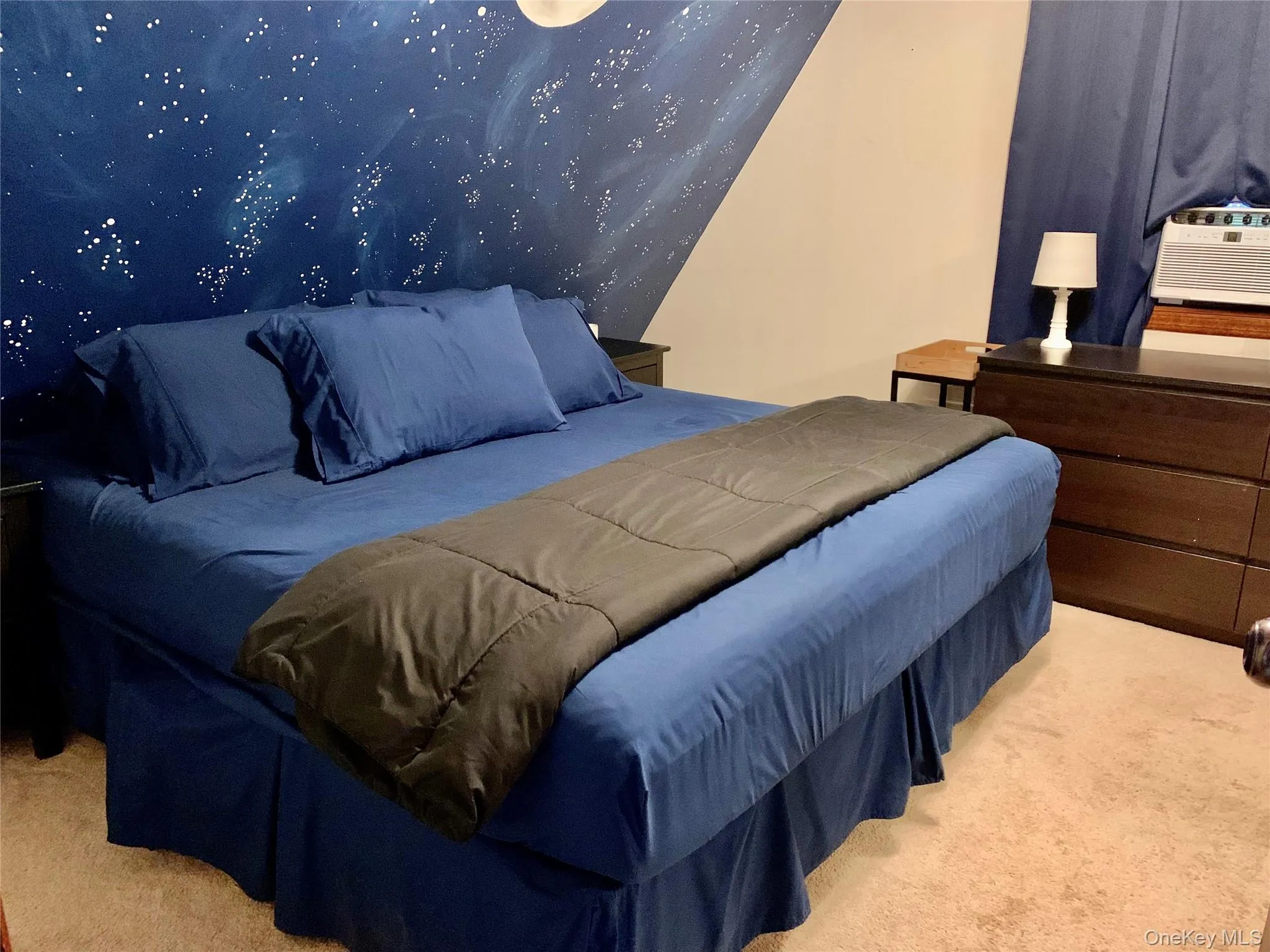 Bedroom featuring light carpet and cooling unit Bedroom featuring light carpet and cooling unit