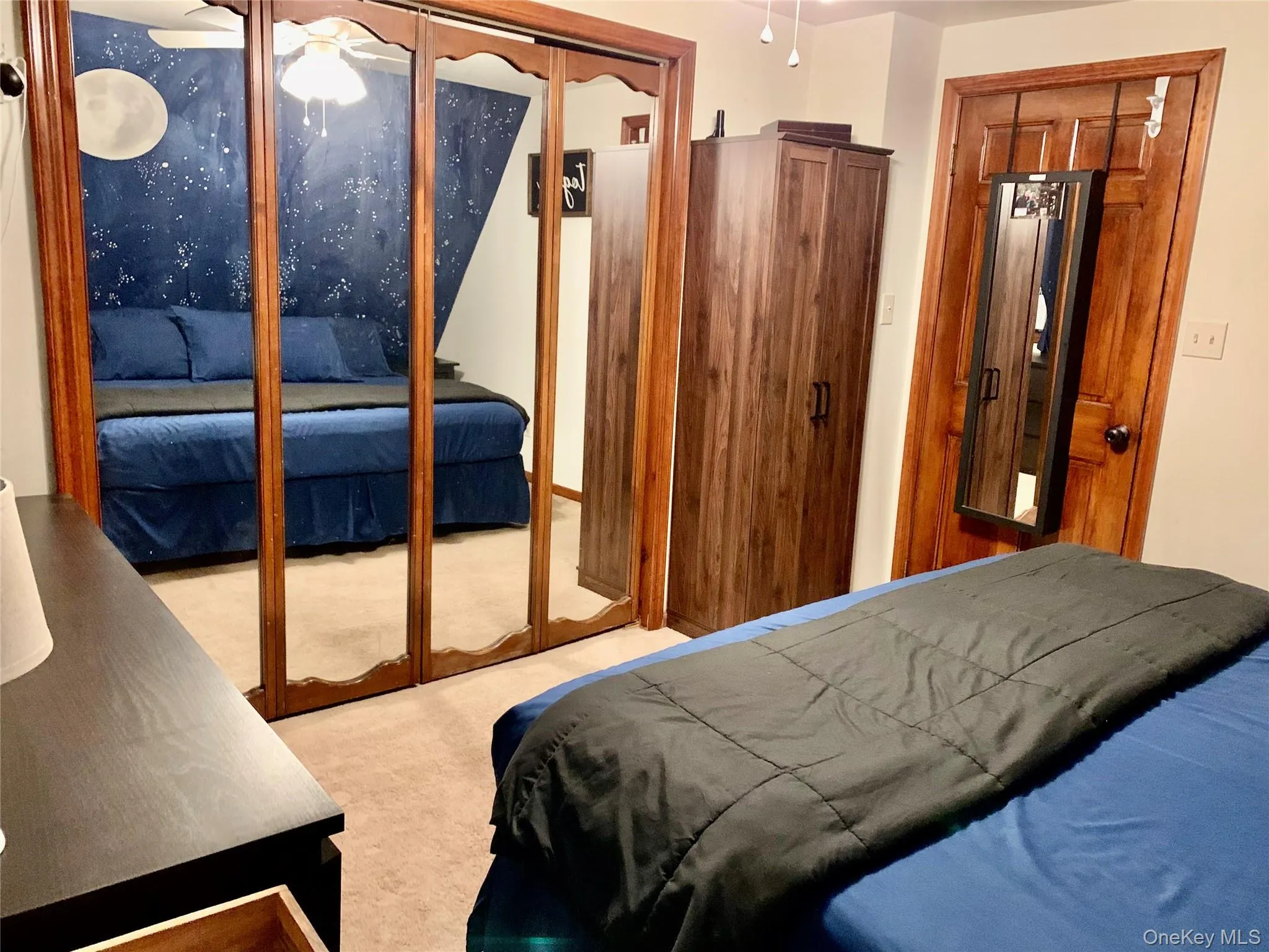 Bedroom featuring a closet and light carpet Bedroom featuring a closet and light carpet