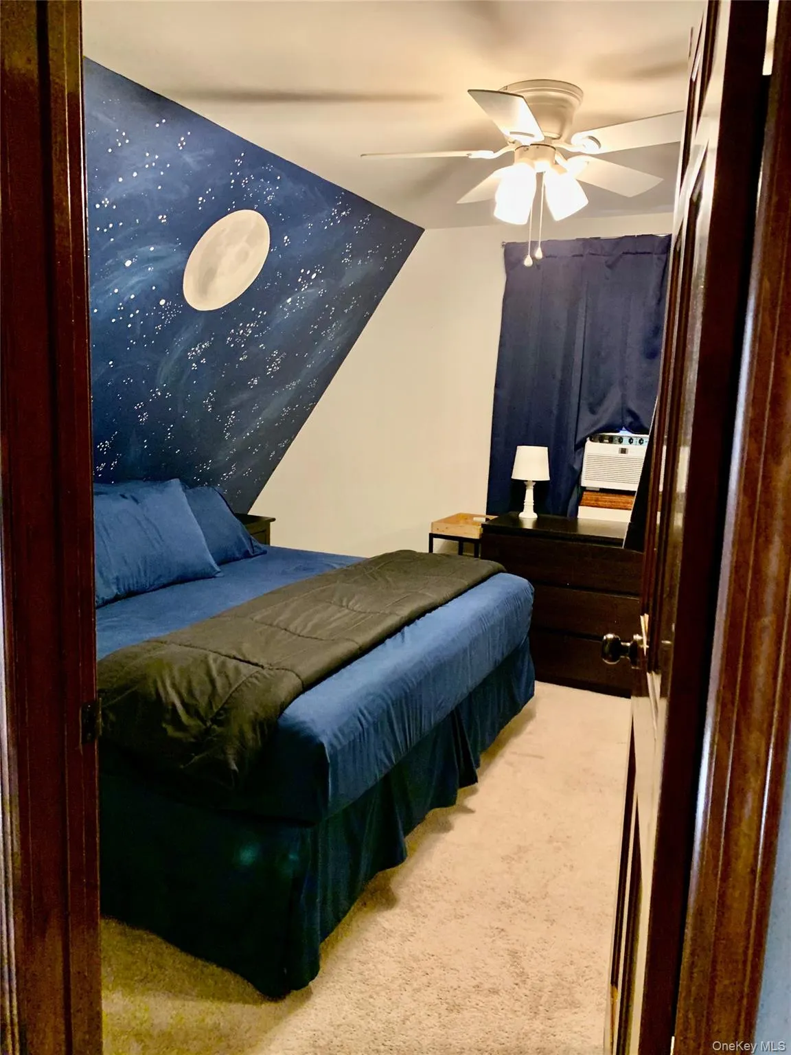 Bedroom with light carpet and ceiling fan Bedroom with light carpet and ceiling fan