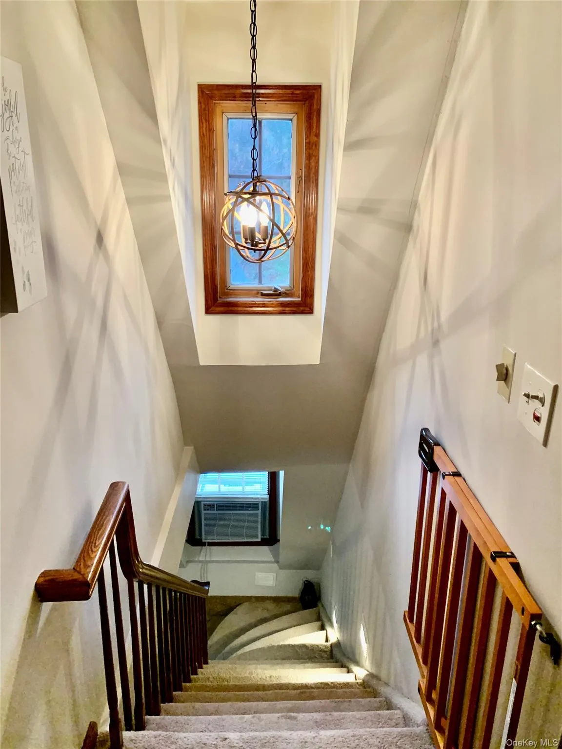 Stairs with a chandelier and cooling unit Stairs with a chandelier and cooling unit