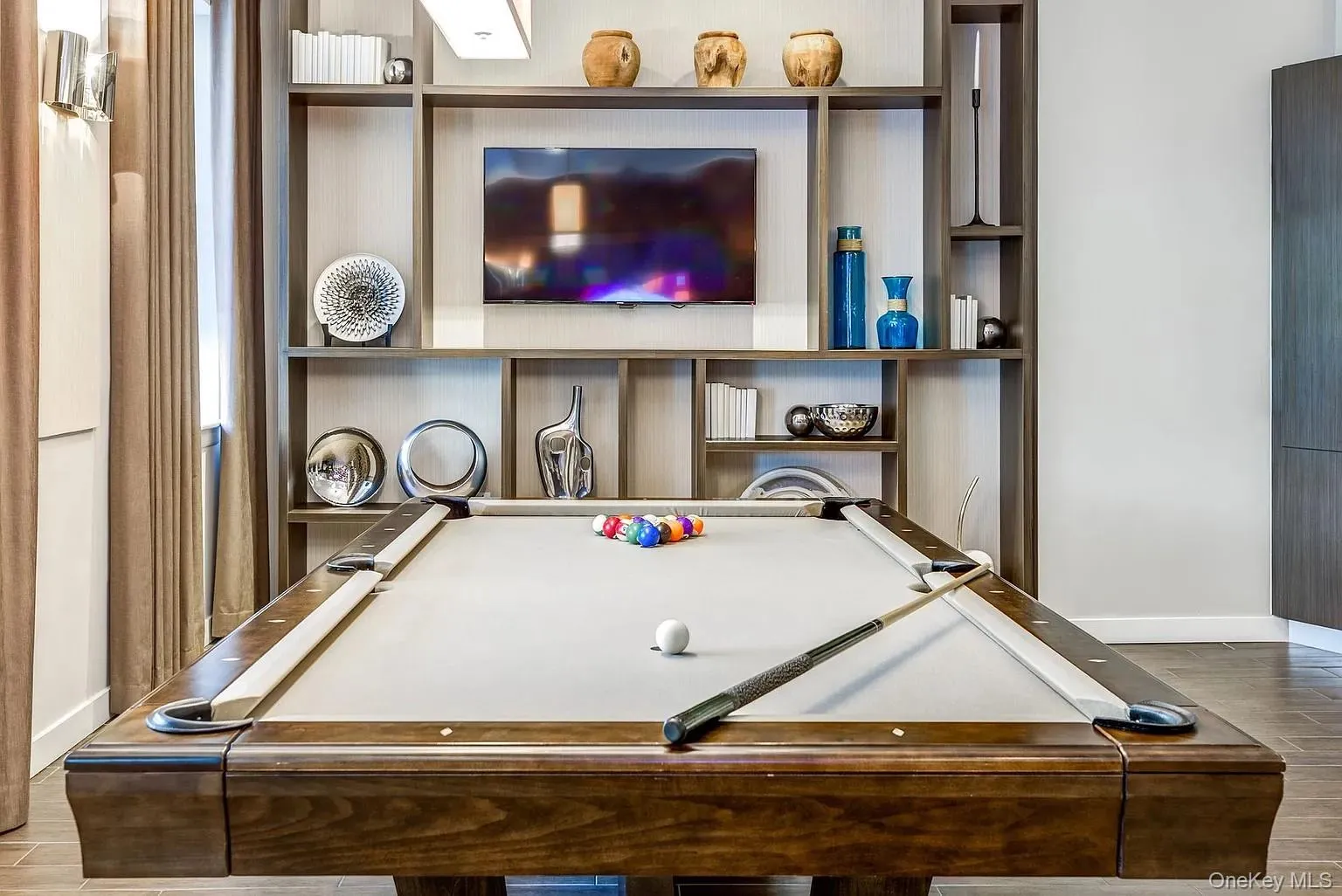 Game room featuring wood finish floors and billiards Game room featuring wood finish floors and billiards