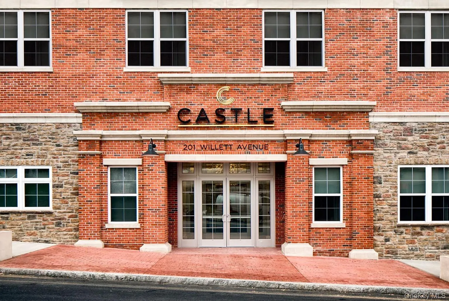 Doorway to property with stone siding, brick siding, and french doors Doorway to property with stone siding, brick siding, and french doors