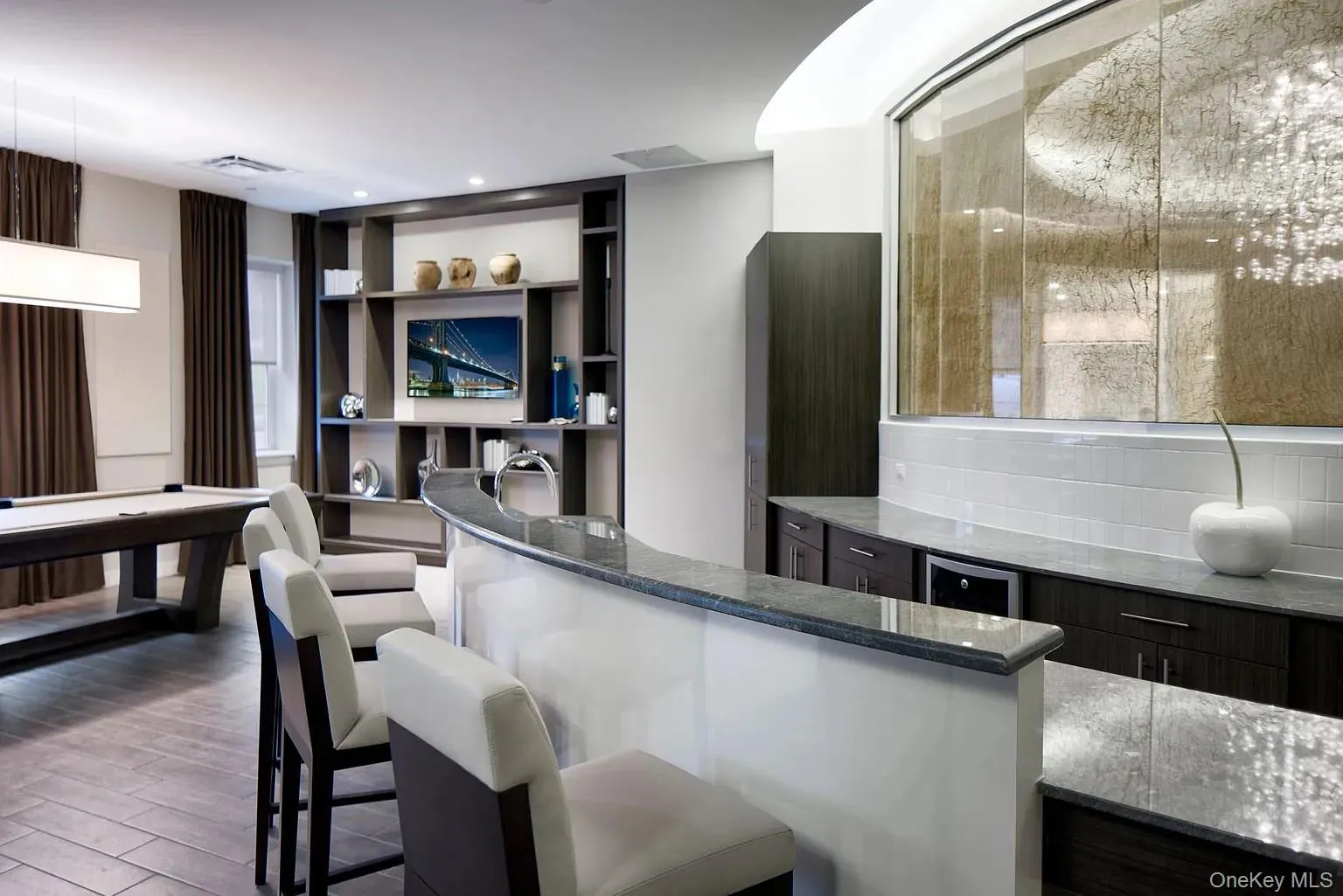 Bar area featuring dark stone countertops, billiards, dark wood finished floors, backsplash, and beverage cooler Bar area featuring dark stone countertops, billiards, dark wood finished floors, backsplash, and beverage cooler