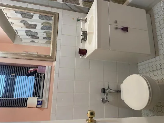 Full bath with vanity and tile walls Full bath with vanity and tile walls