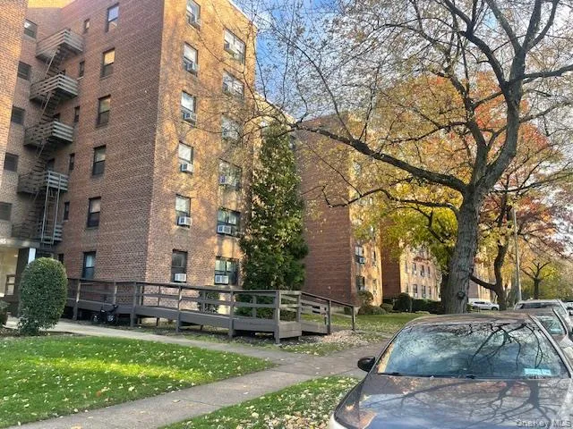 View of apartment building / complex with cooling unit View of apartment building / complex with cooling unit