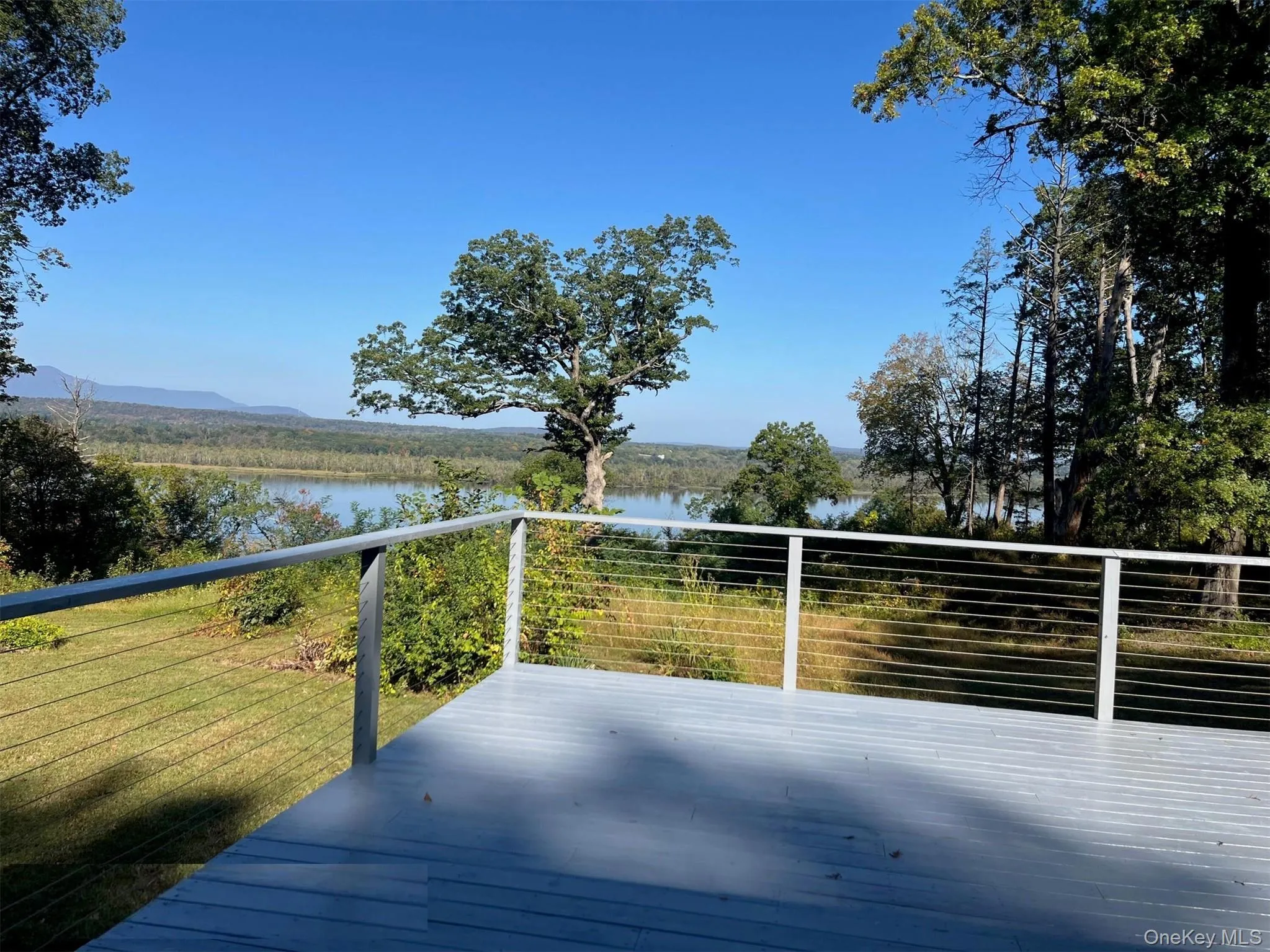 Wooden deck with a water view Wooden deck with a water view