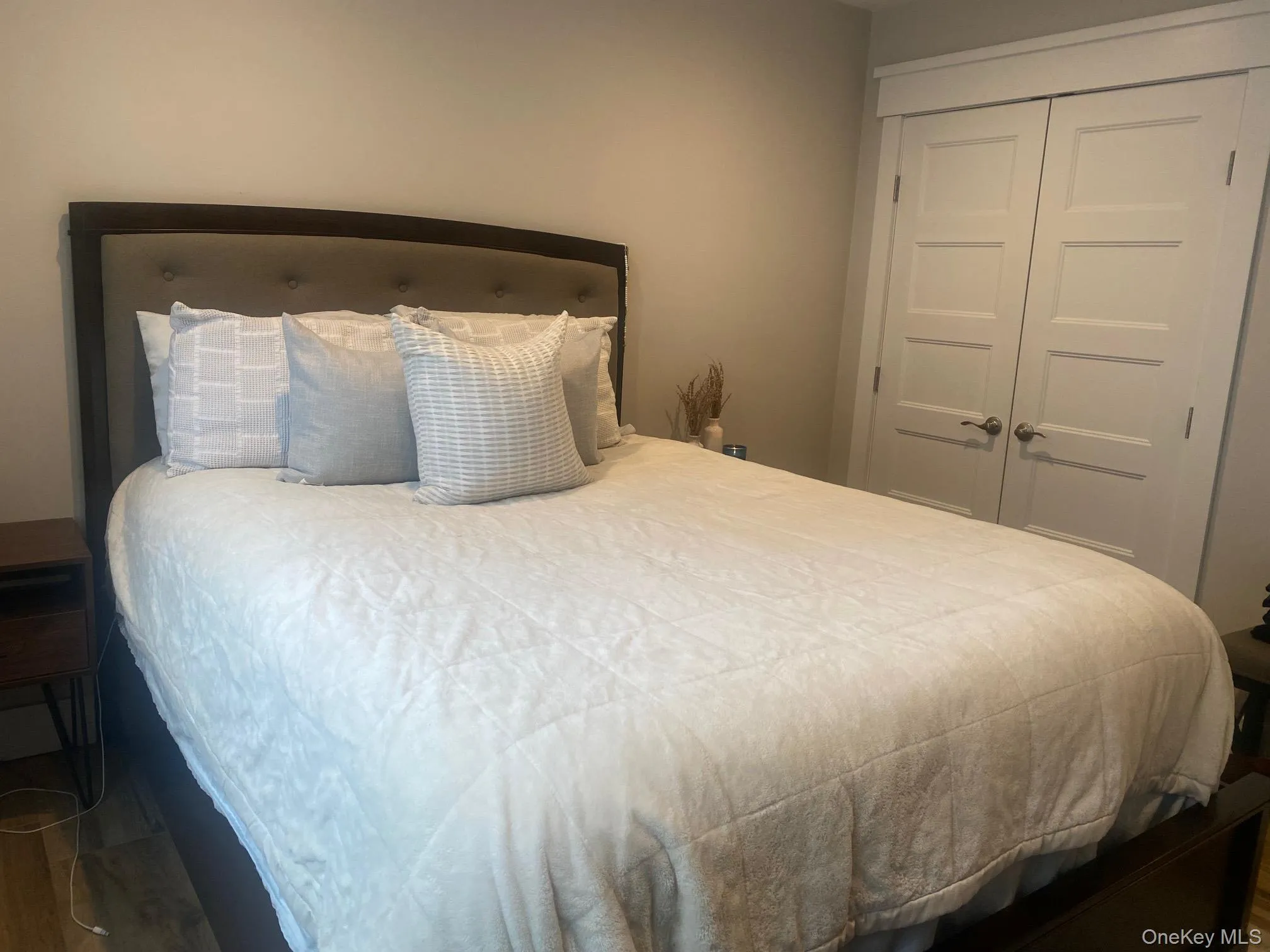 1st Bedroom featuring a closet and wood finished floors 1st Bedroom featuring a closet and wood finished floors
