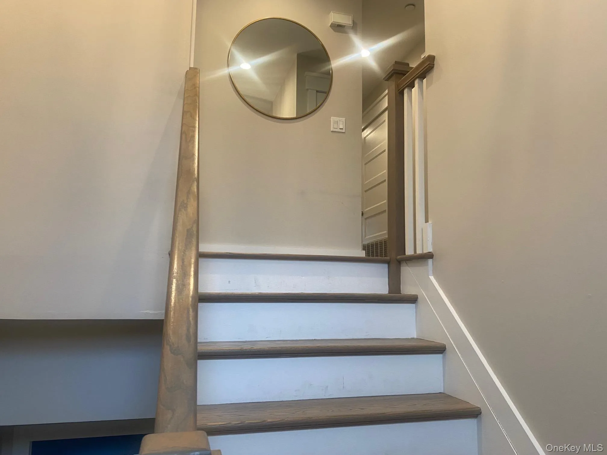 View of staircase up to apartment. View of staircase up to apartment.