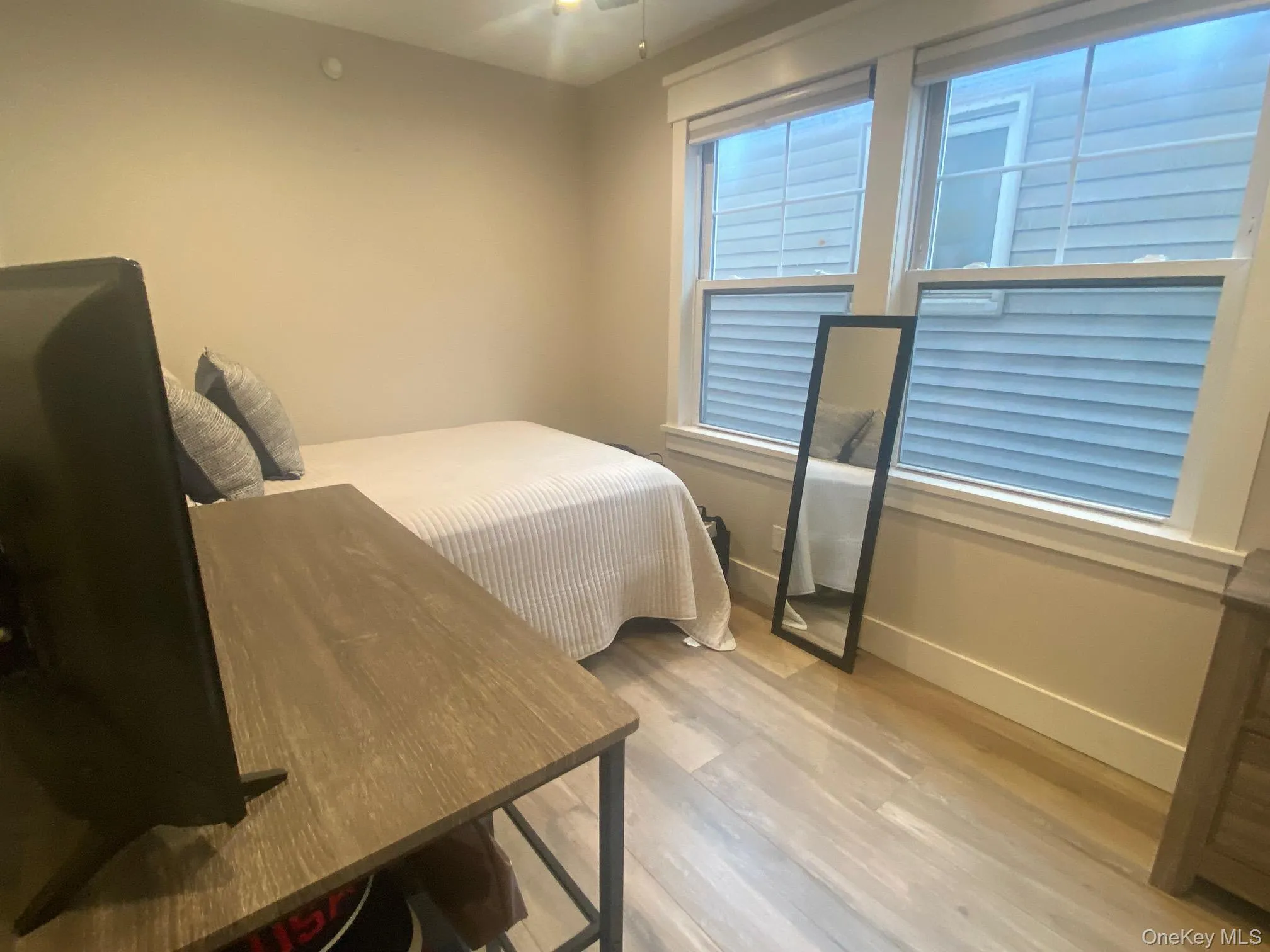 2nd Bedroom featuring baseboards and light wood-style flooring 2nd Bedroom featuring baseboards and light wood-style flooring