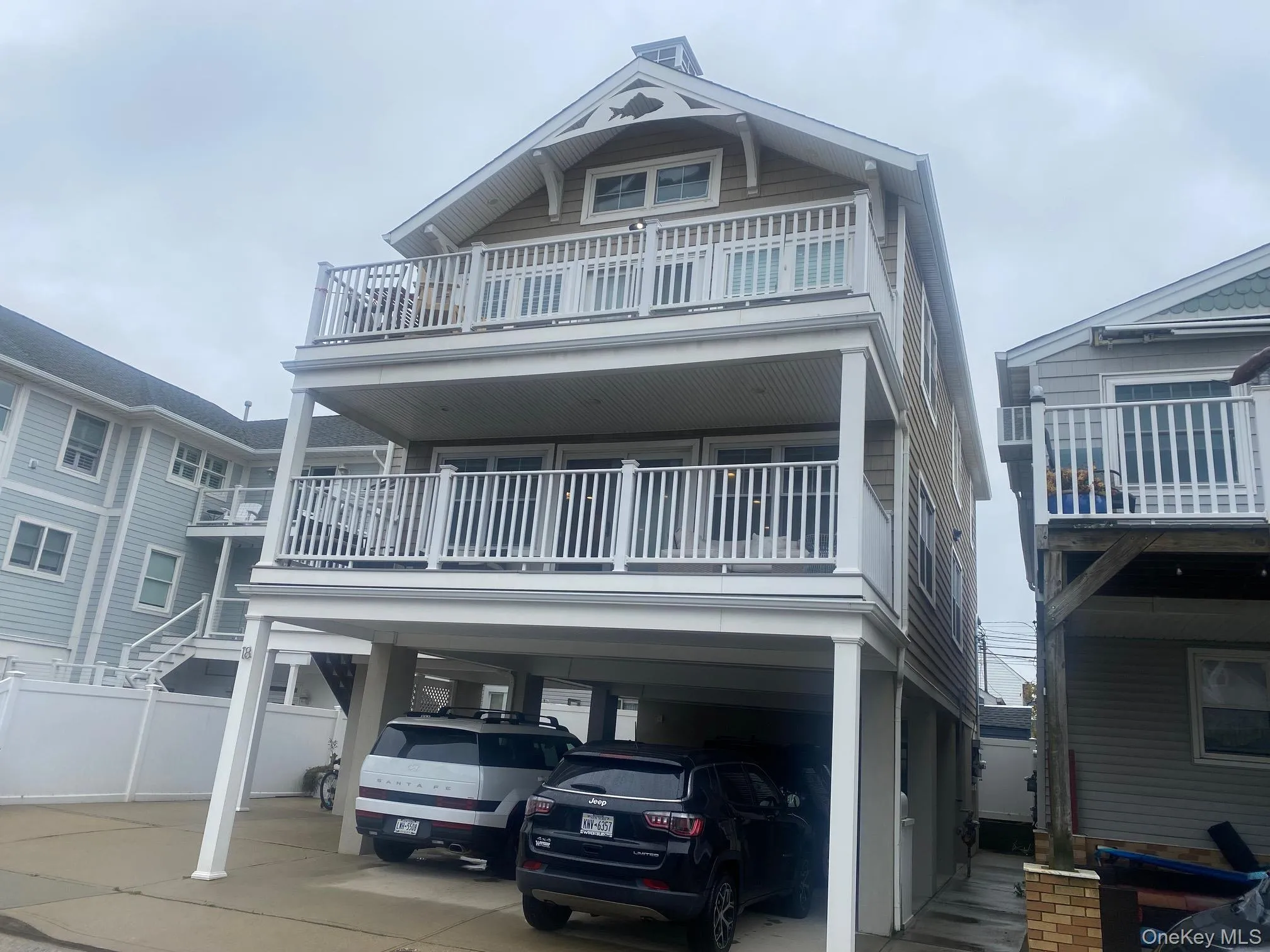 Coastal home with a carport and driveway Coastal home with a carport and driveway