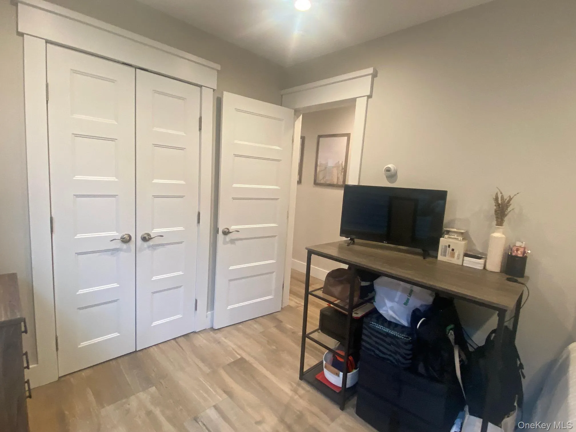 2nd bedroom Large enough to have Office featuring light wood-type flooring 2nd bedroom Large enough to have Office featuring light wood-type flooring