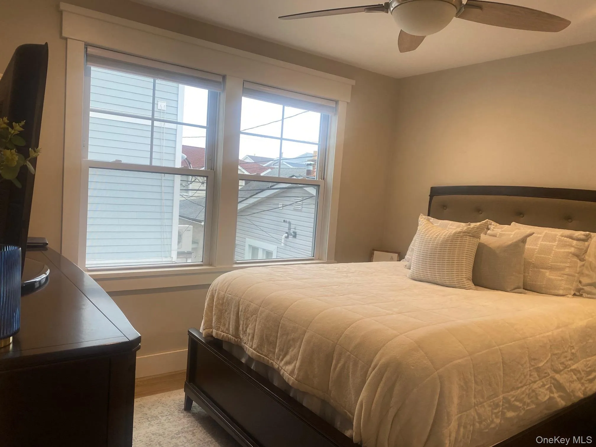 1st Bedroom with light wood-type flooring and a ceiling fan 1st Bedroom with light wood-type flooring and a ceiling fan