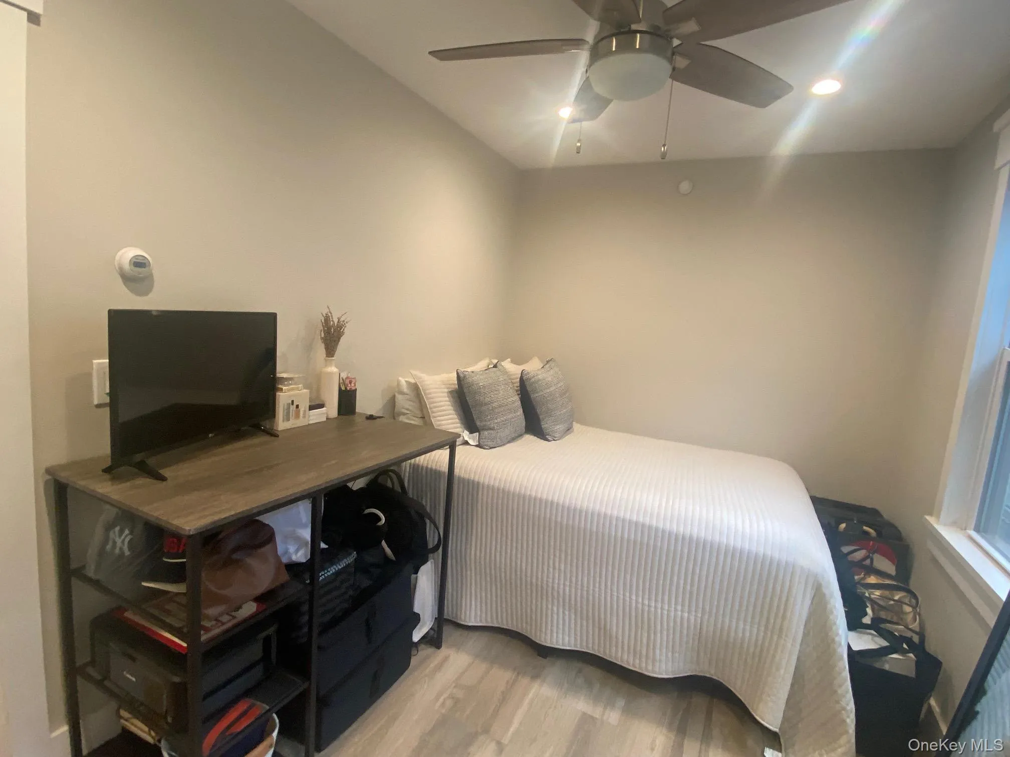 2nd Bedroom featuring light wood finished floors, ceiling fan, and recessed lighting 2nd Bedroom featuring light wood finished floors, ceiling fan, and recessed lighting