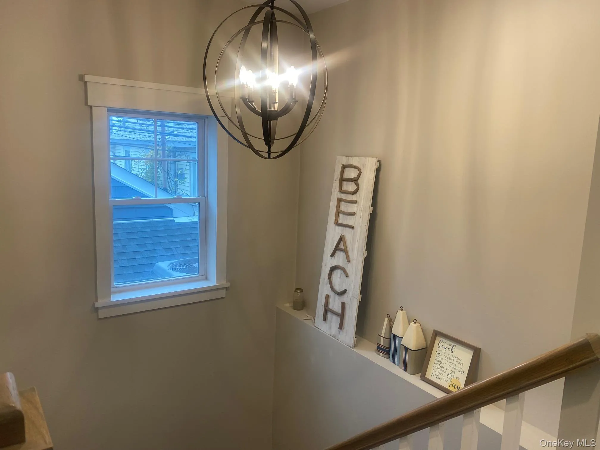 Detailed view of a chandelier in entry. Detailed view of a chandelier in entry.