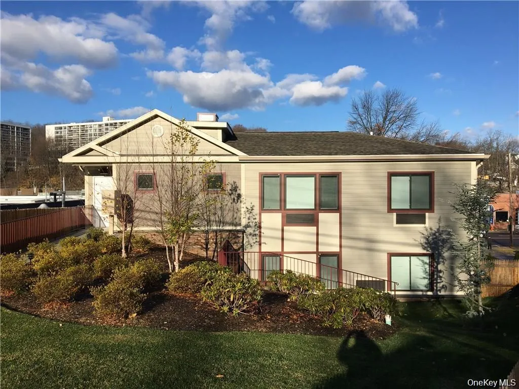 Back of property with a shingled roof and a chimney Back of property with a shingled roof and a chimney