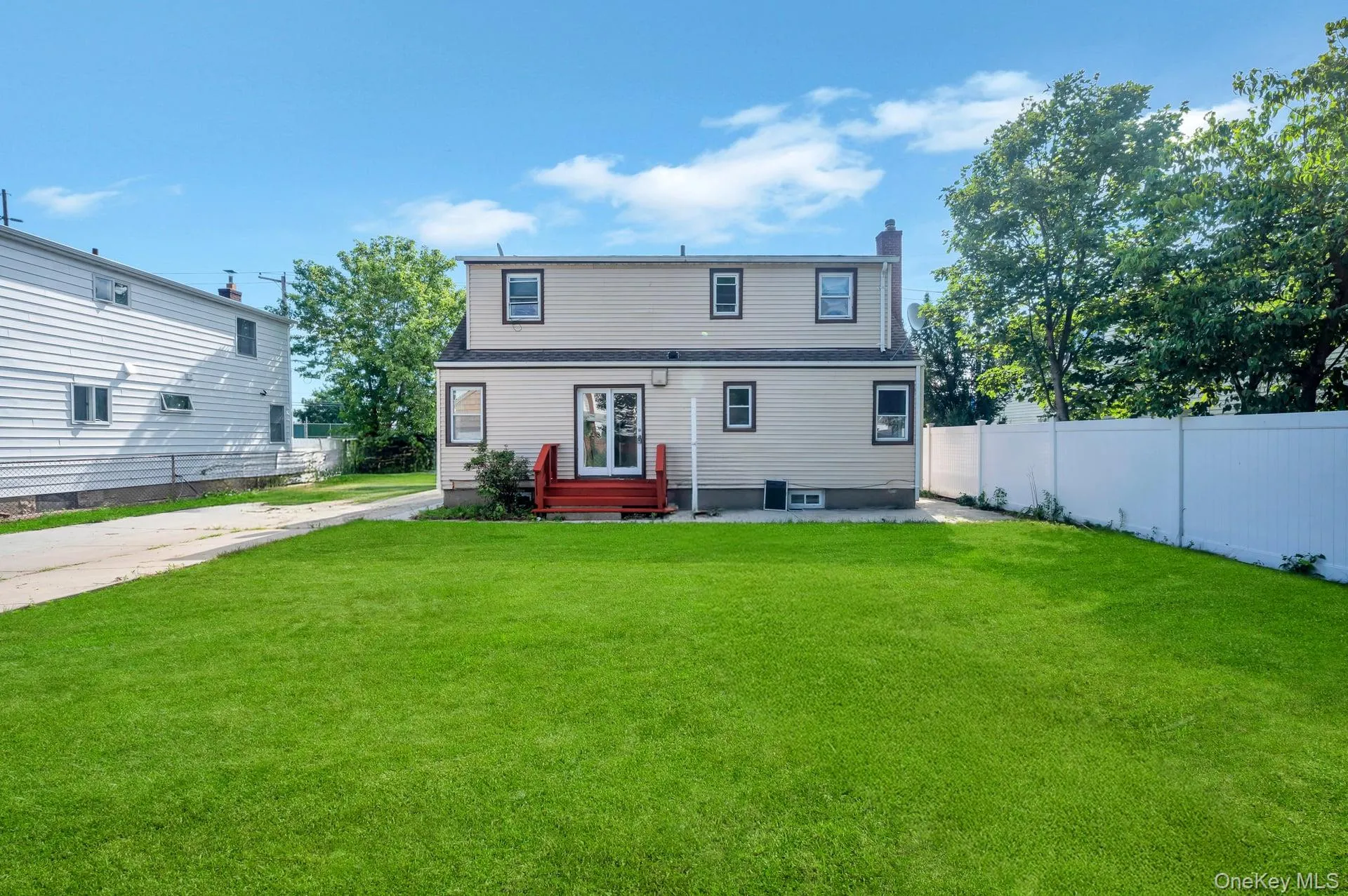 Back of house with a chimney Back of house with a chimney