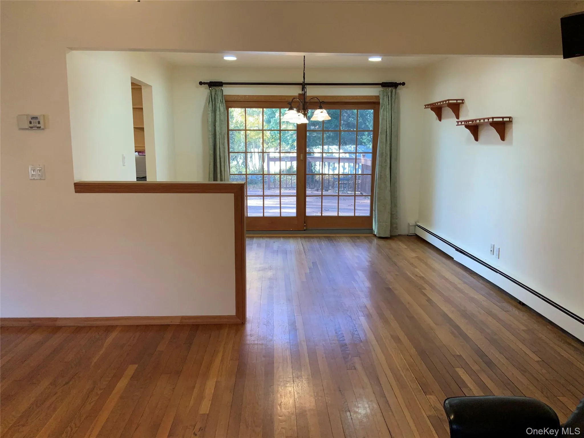 Unfurnished dining area featuring a chandelier, hardwood / wood-style floors, and recessed lighting Unfurnished dining area featuring a chandelier, hardwood / wood-style floors, and recessed lighting