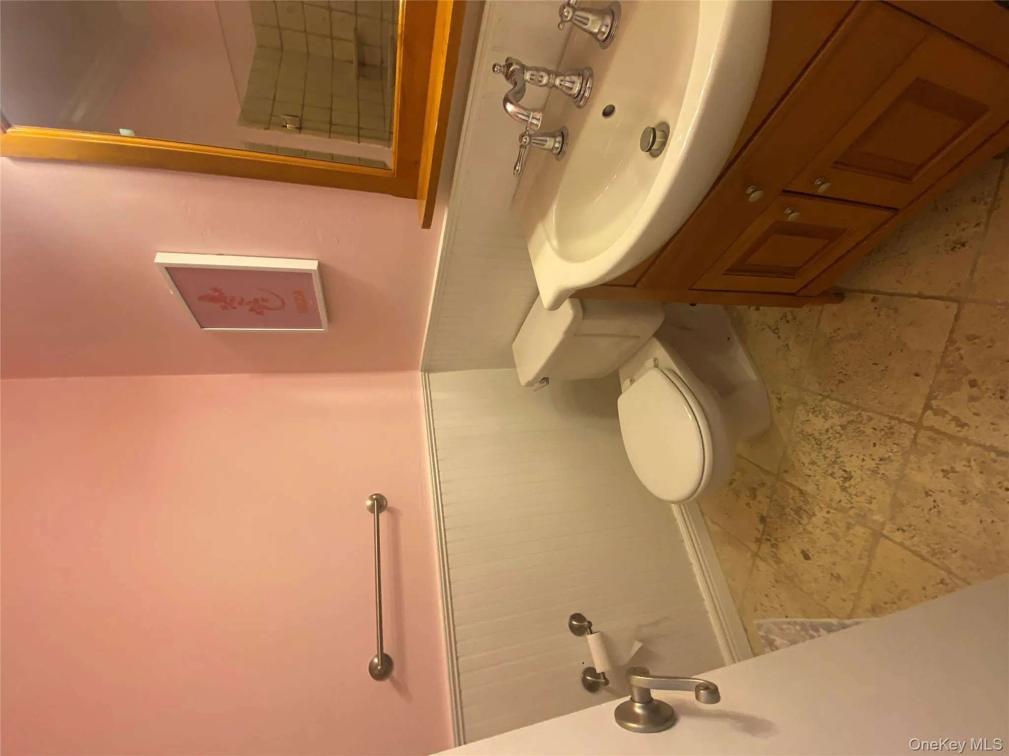 Bathroom featuring vanity and wainscoting Bathroom featuring vanity and wainscoting